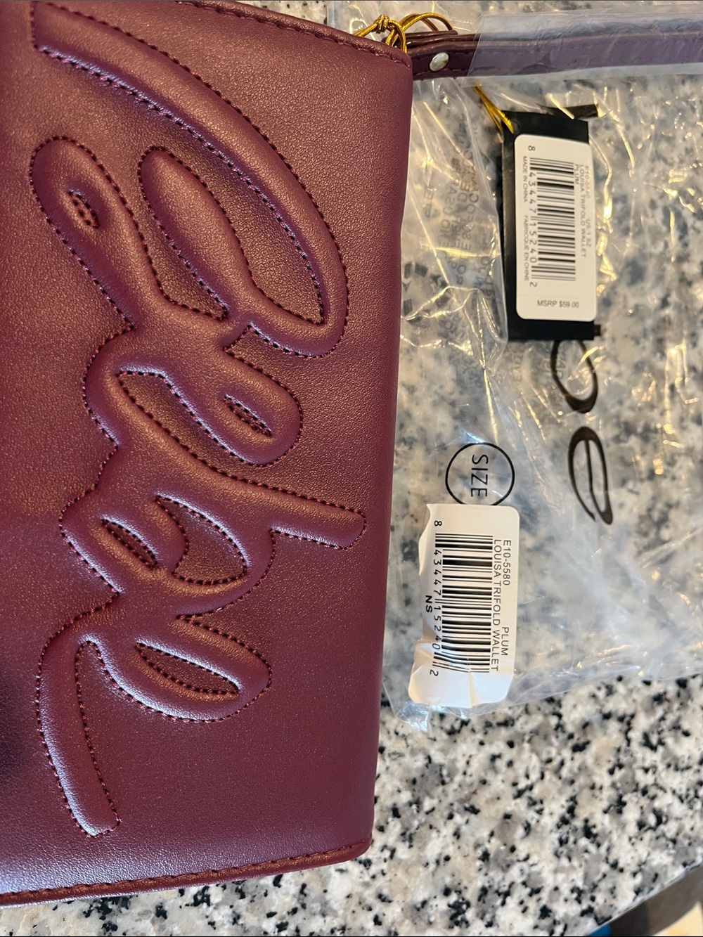 bebe Plum Embossed Logo Wristlet